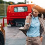 A driver talking on the phone after a car accident