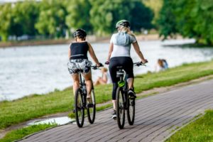Two bicycle riders on a bike path