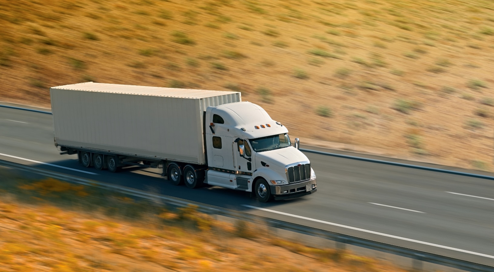 An 18-wheeler truck driving on the highway