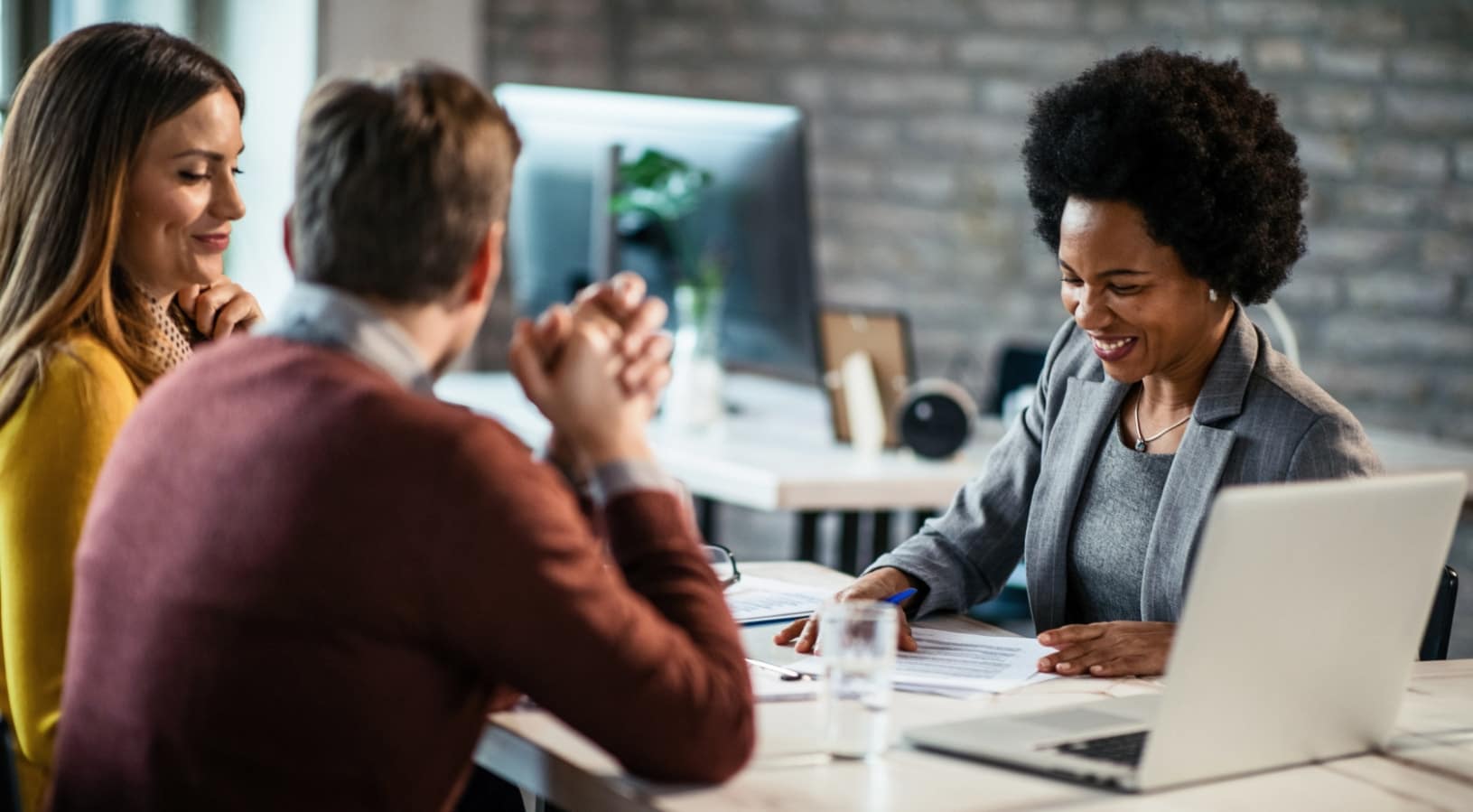 A couple meeting with a personal injury attornety
