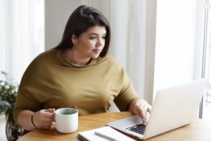 A woman doing research to find a personal injury attorney